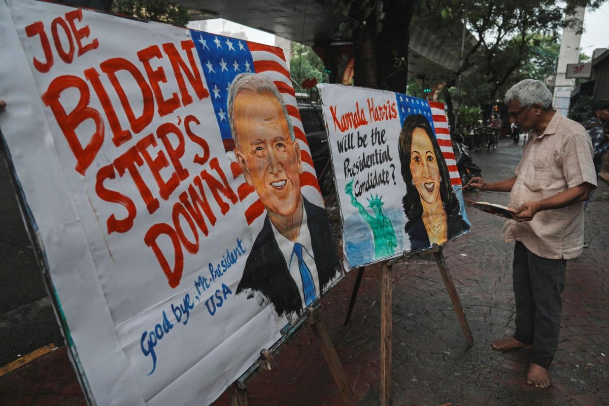 Paintings of U.S. President Joe Biden and Vice President Kamala Harris are seen on the streets of Mumbai, India, following Biden ending his re-election campaign.