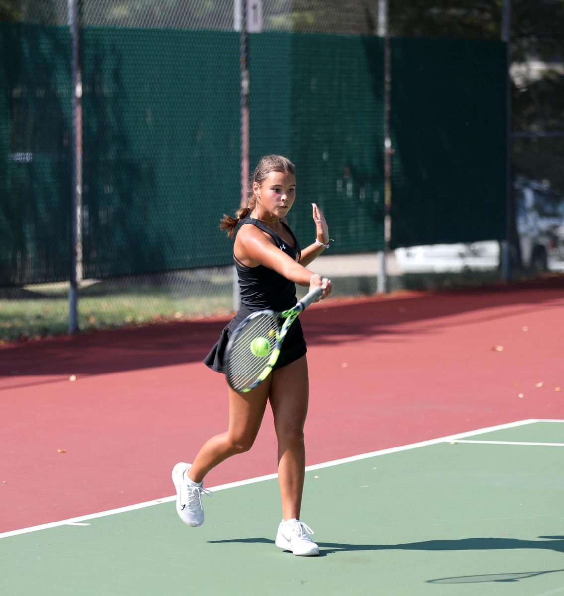 Junior Katie Woods hits during a match Sept. 16 2023.