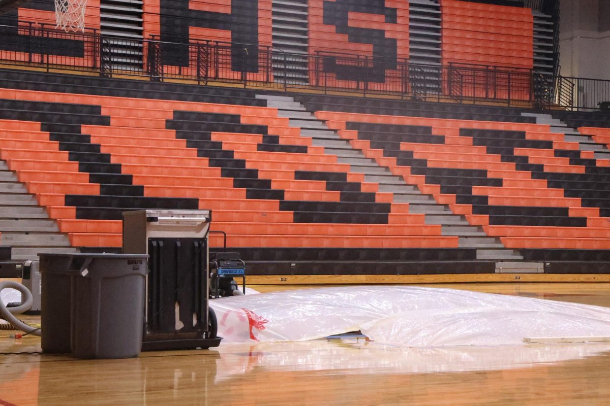 The Lucco-Jackson Gym floor has buckled due to moisture from an unknown source.