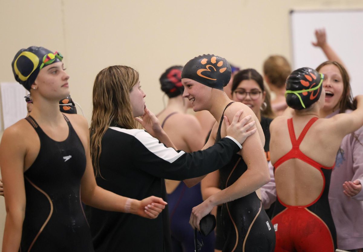 The girls swim team celebrates after the sectional meet on Nov. 9.