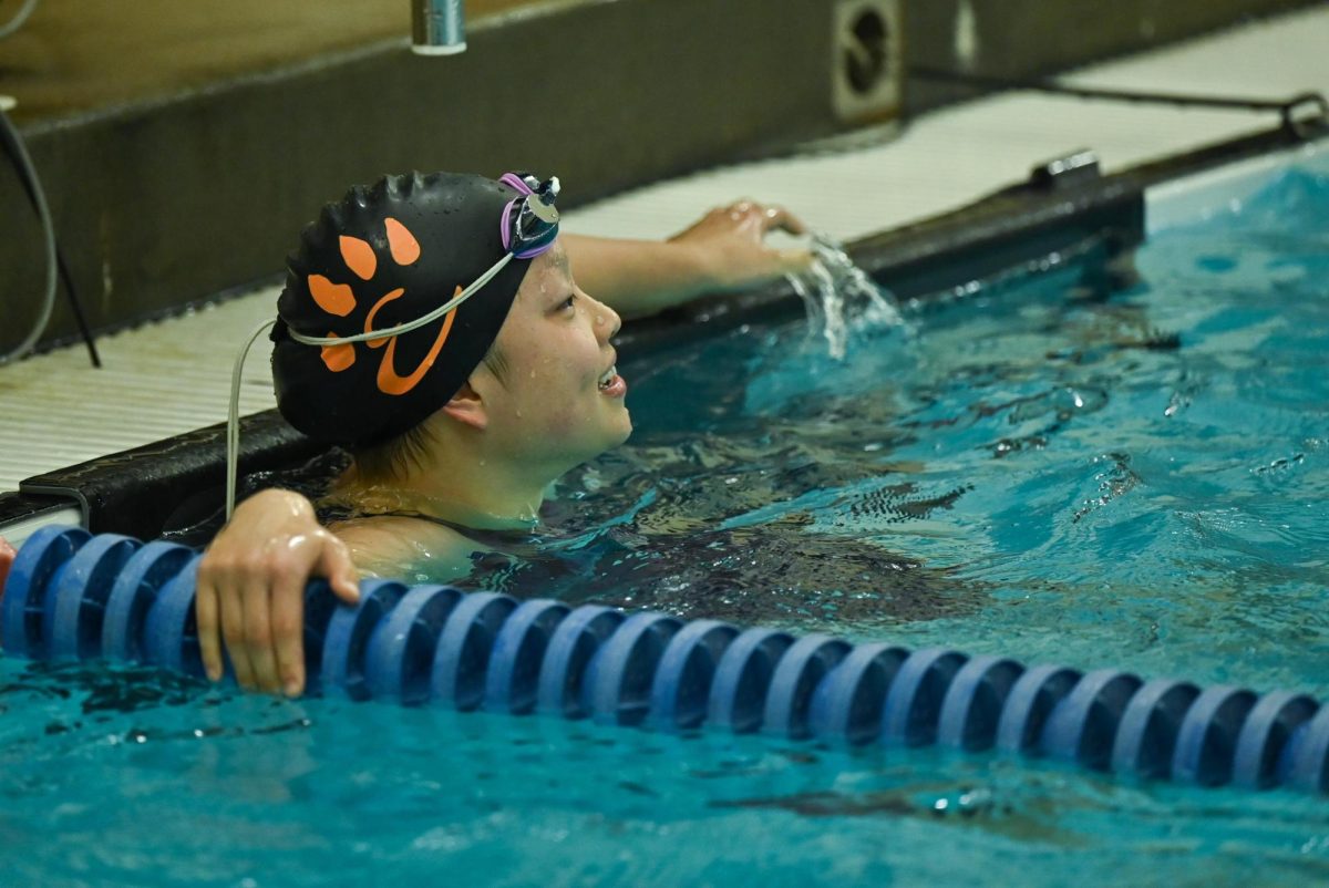 Senior Karis Chen celebrates during the sectional meet Nov. 9.