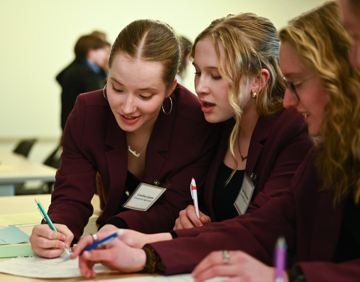 Team Orange deliberates during sectionals