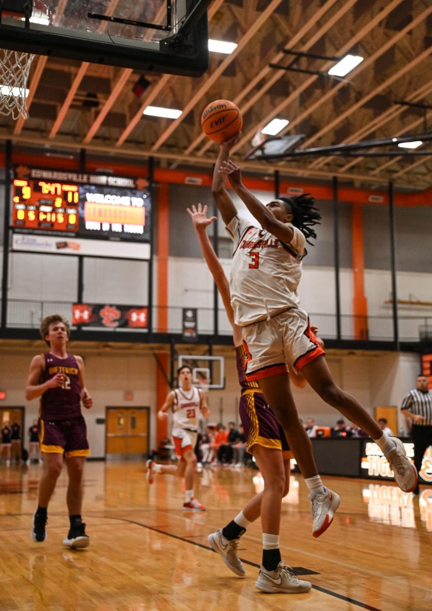 Senior guard Herbert Martin scores on a layup through contact during a match against Dietrich on January 2