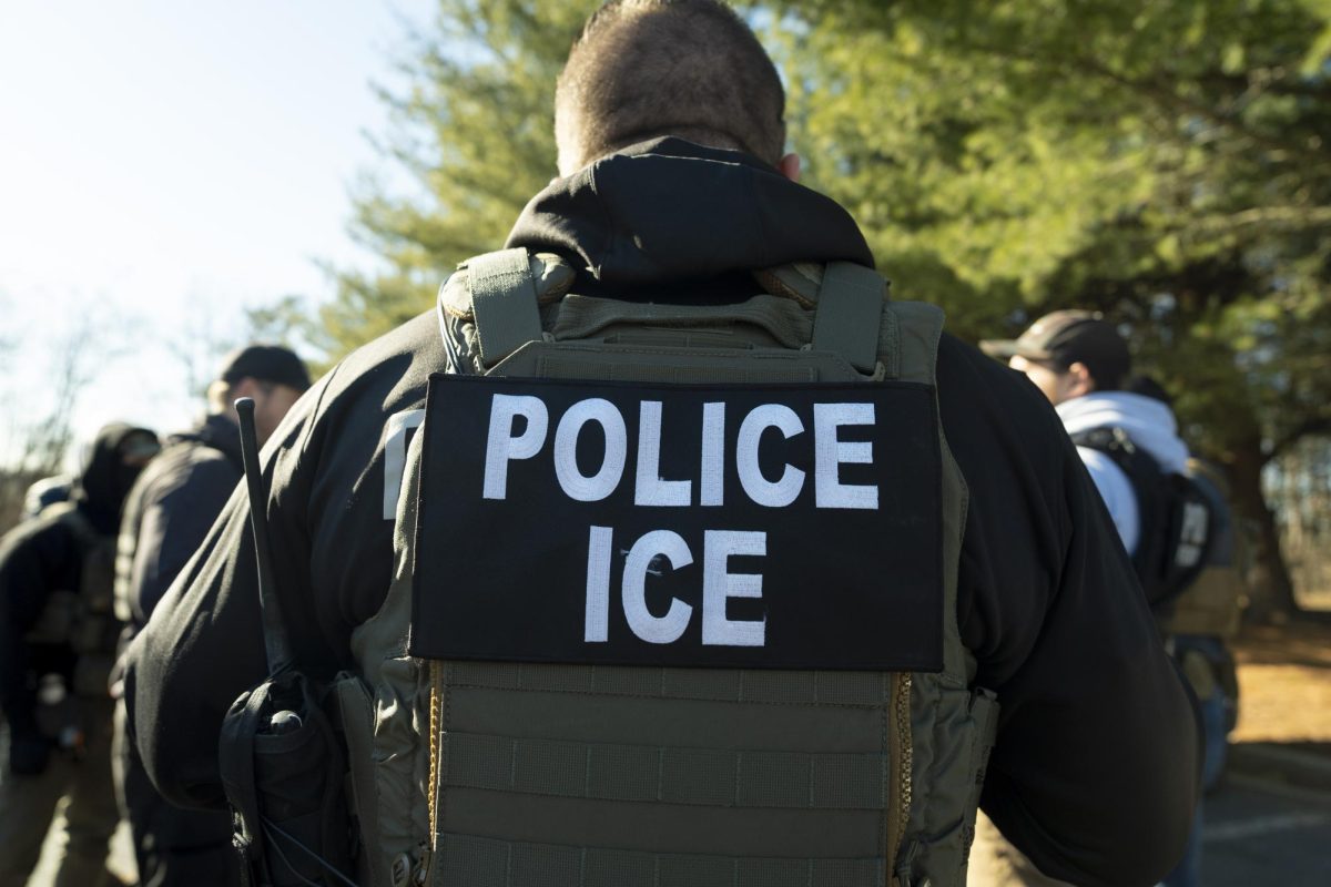 U.S. Immigration and Customs Enforcement Baltimore Field Officer director Matt Elliston listens during a briefing Jan. 27.