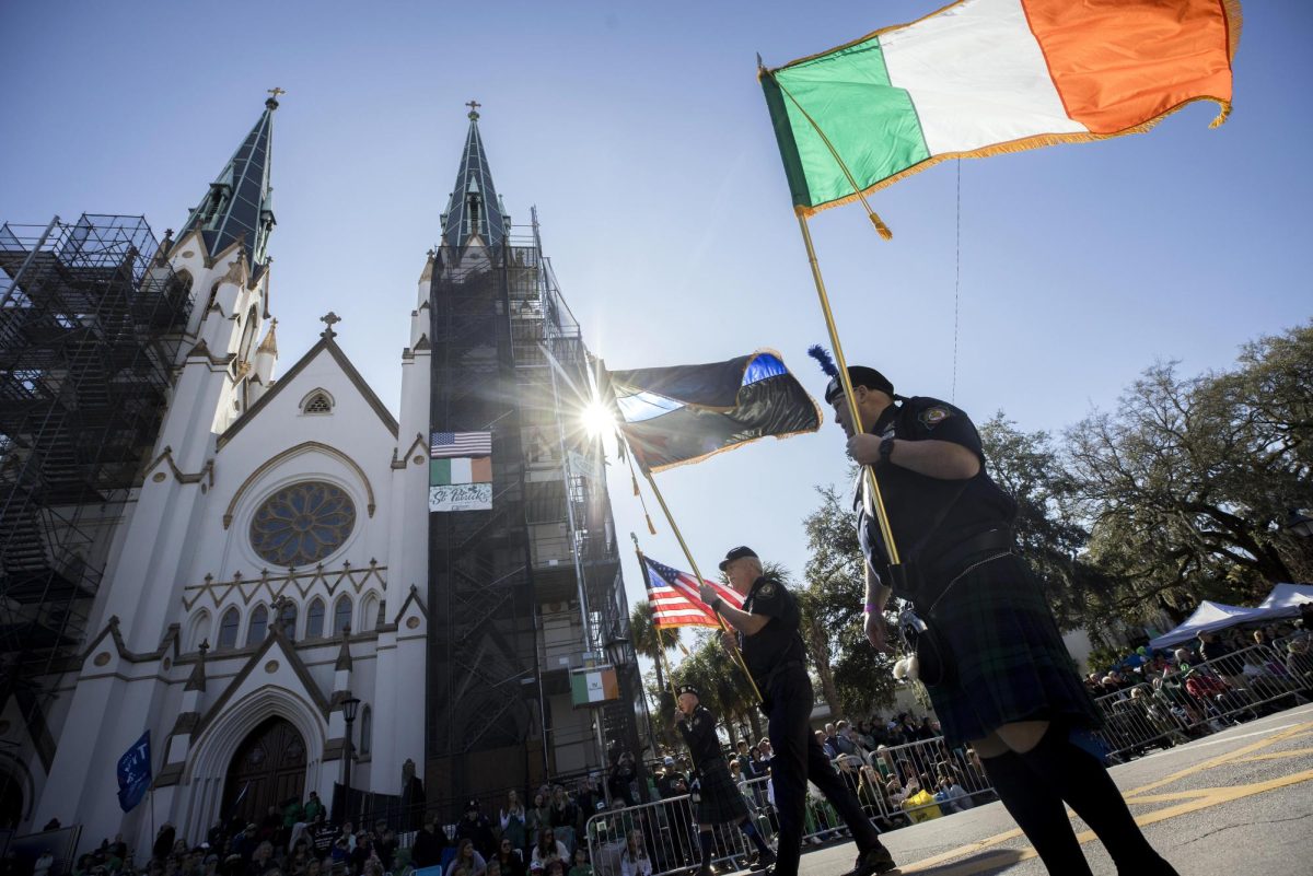 Officer carries Irish flag during St. Patricks Day Parade in Savannah, Ga. Monday, March 17, 2025